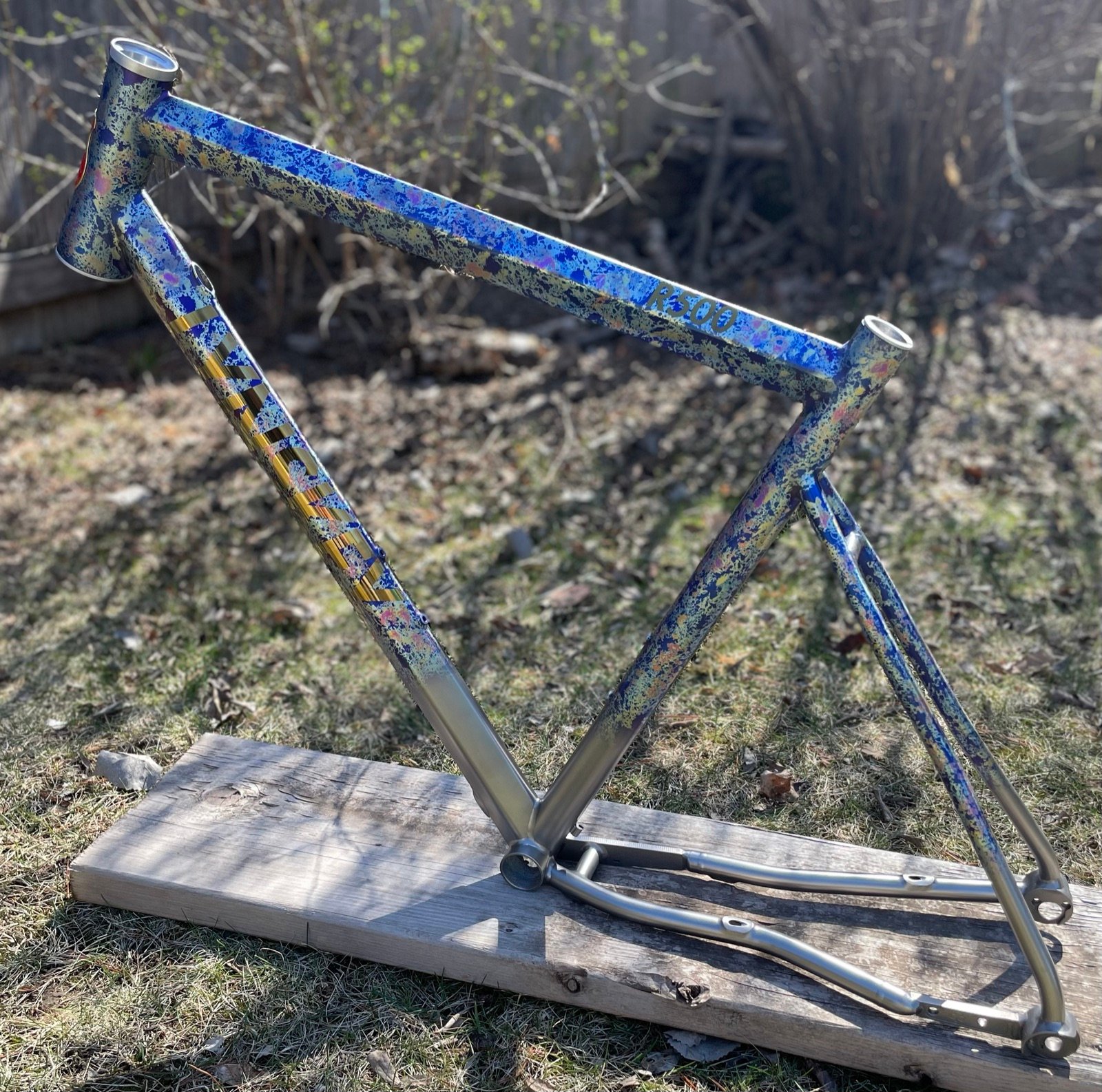 Titanium frame with blue and gold speckle anodizing