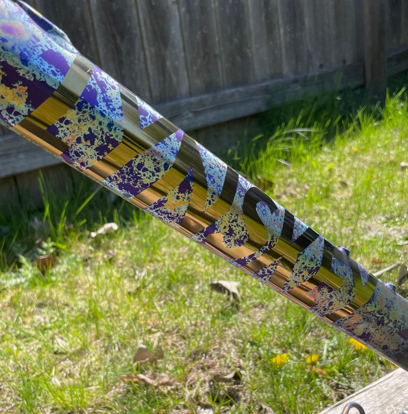 Close-up of gold and violet crackle anodizing on a down tube